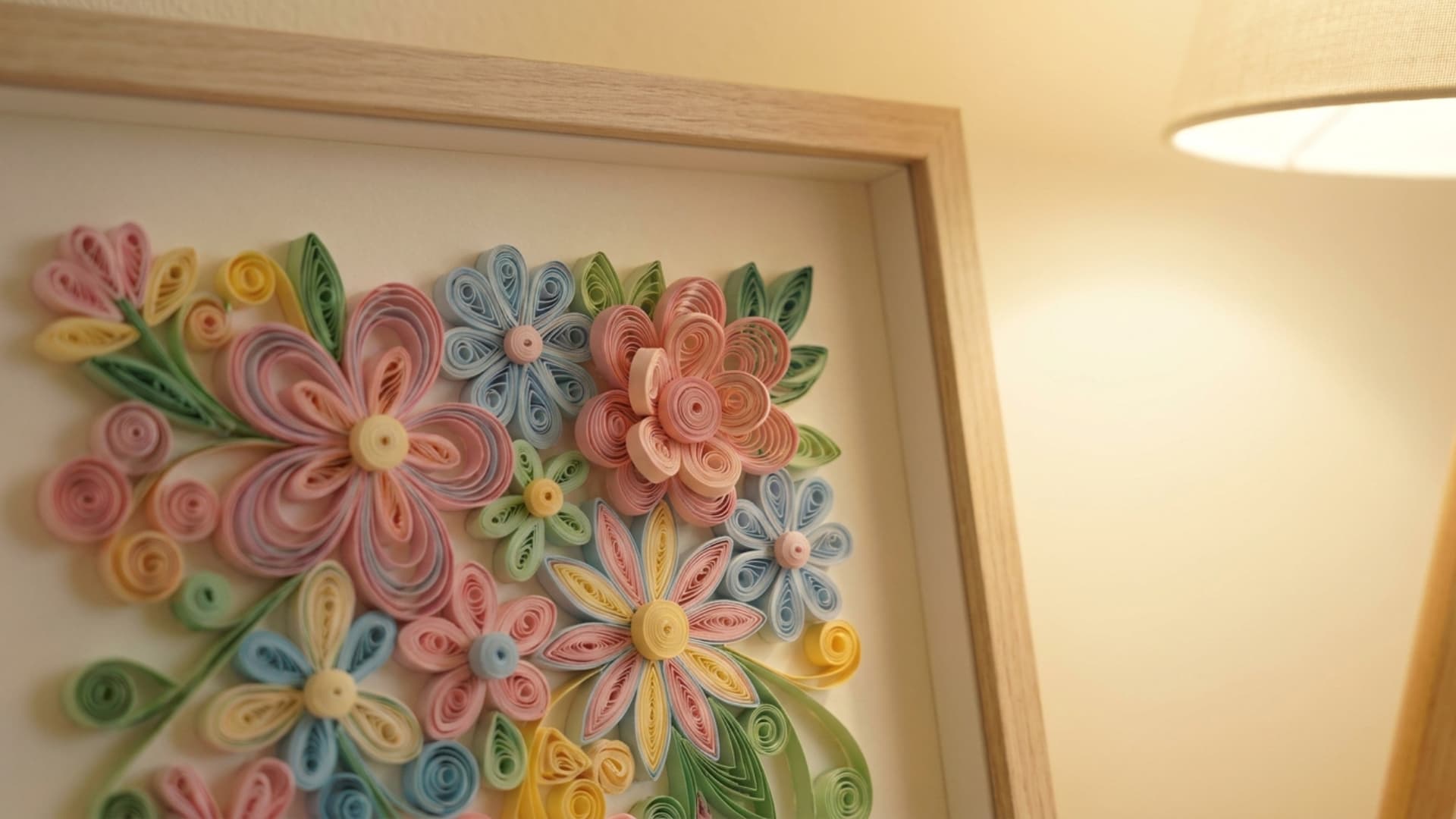 paper quilling wall art in colorful coil patterns mounted in shadow box frame