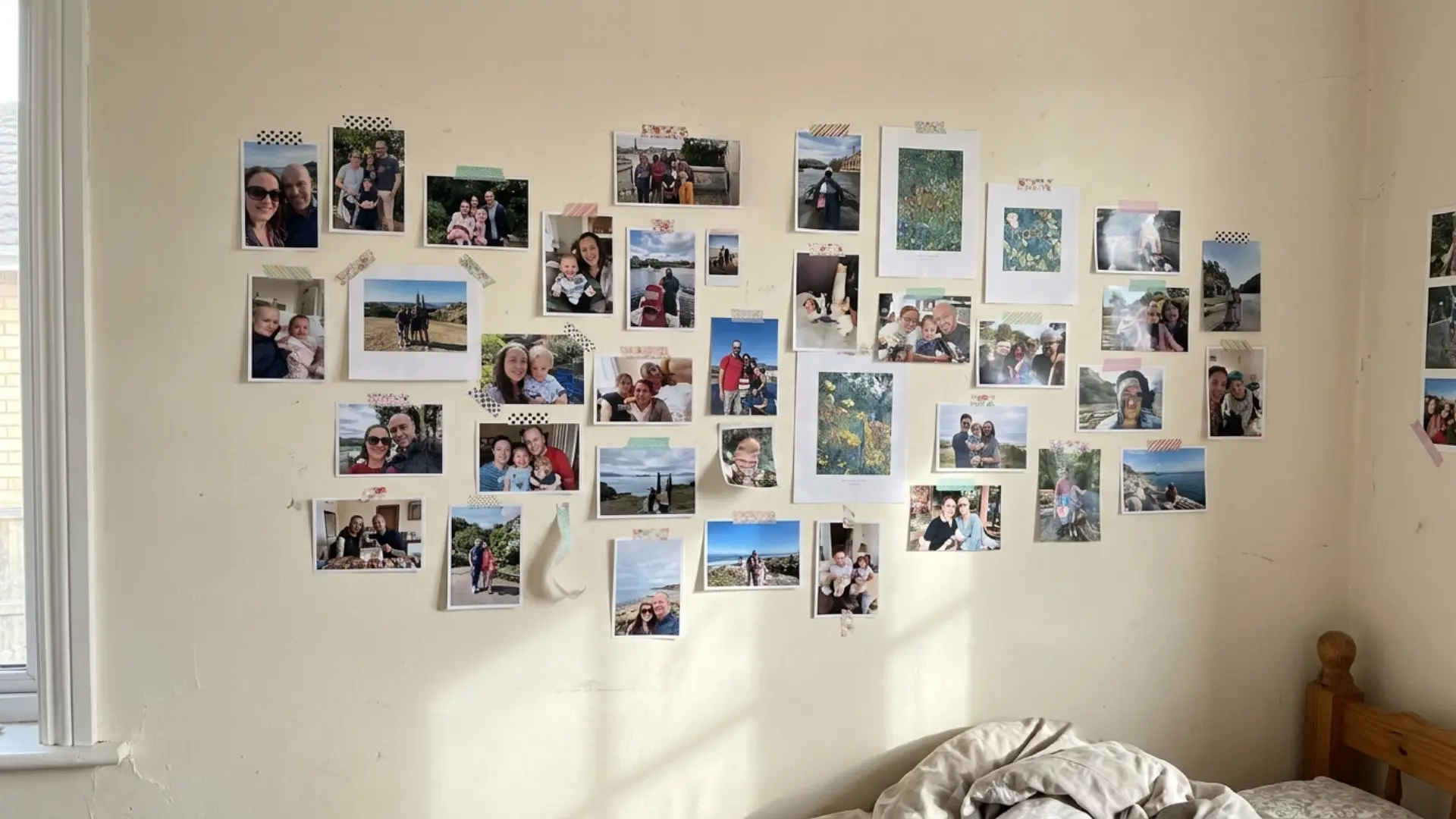 washi tape photo borders with printed pictures taped directly onto white bedroom wall