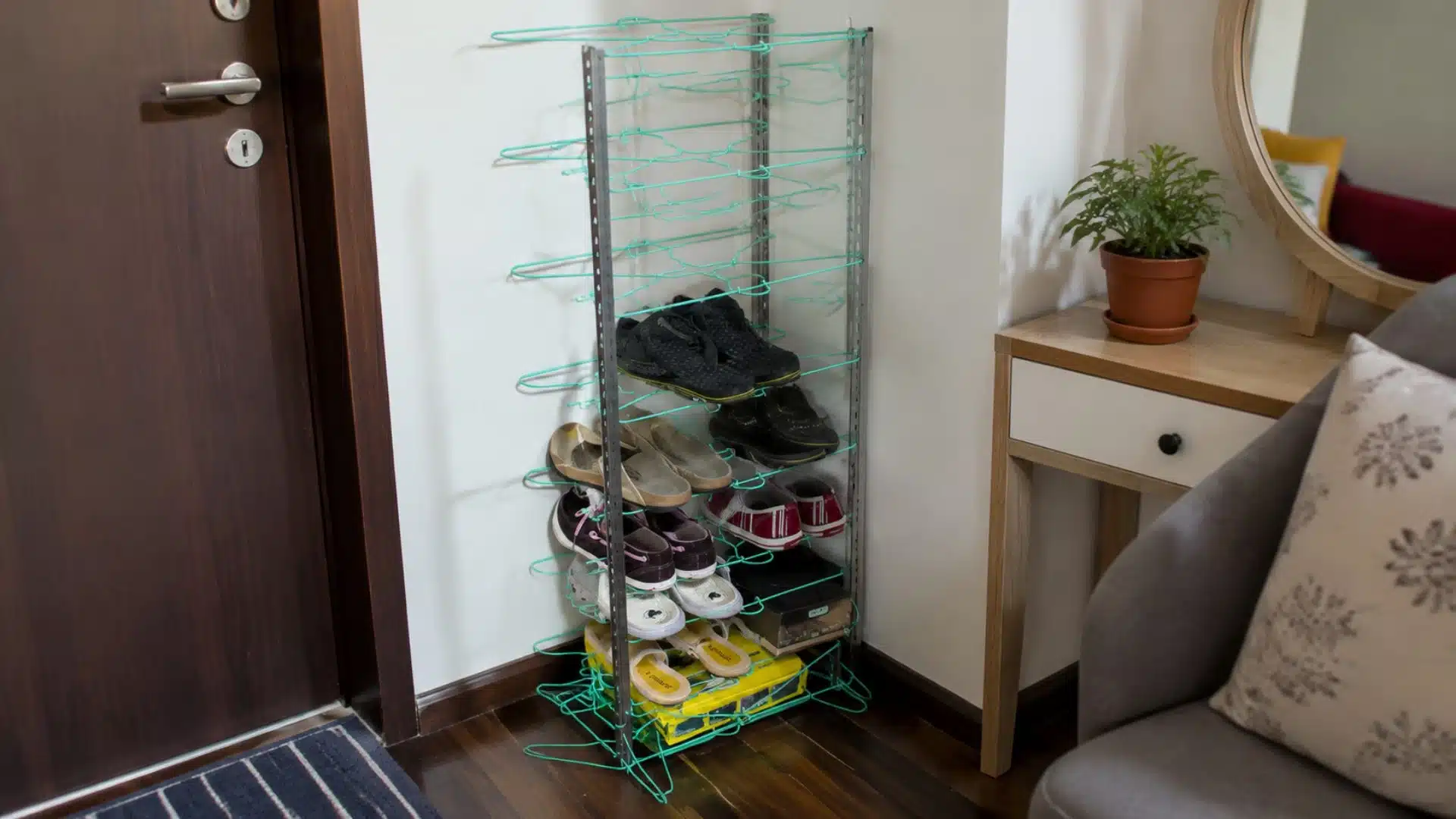 a wooden shoe rack filled with various pairs of shoes in a well-lit room with neutral-colored walls and a cozy atmosphere