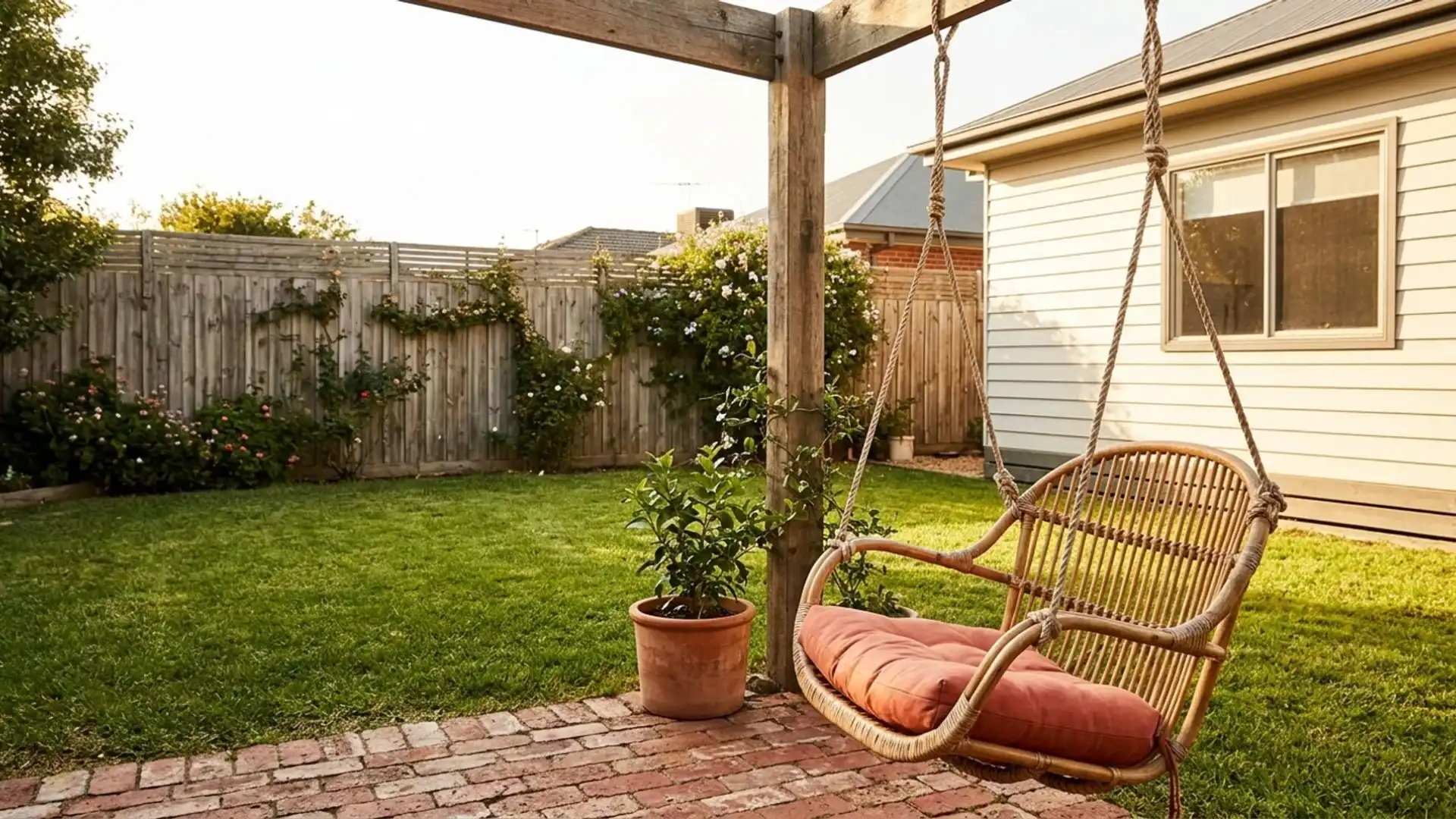  backyard scene featuring a swing set and a potted plant, creating a serene outdoor atmosphere.