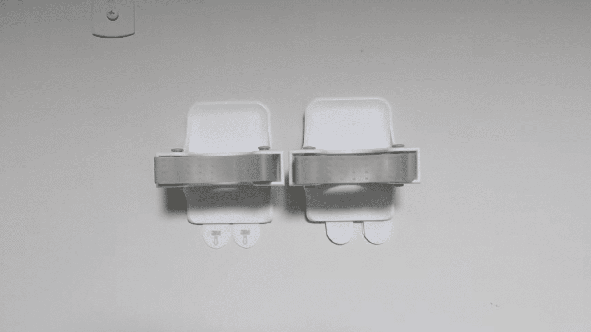 mop and broom holder grippers mounted on wall as no-drill curtain rod hooks