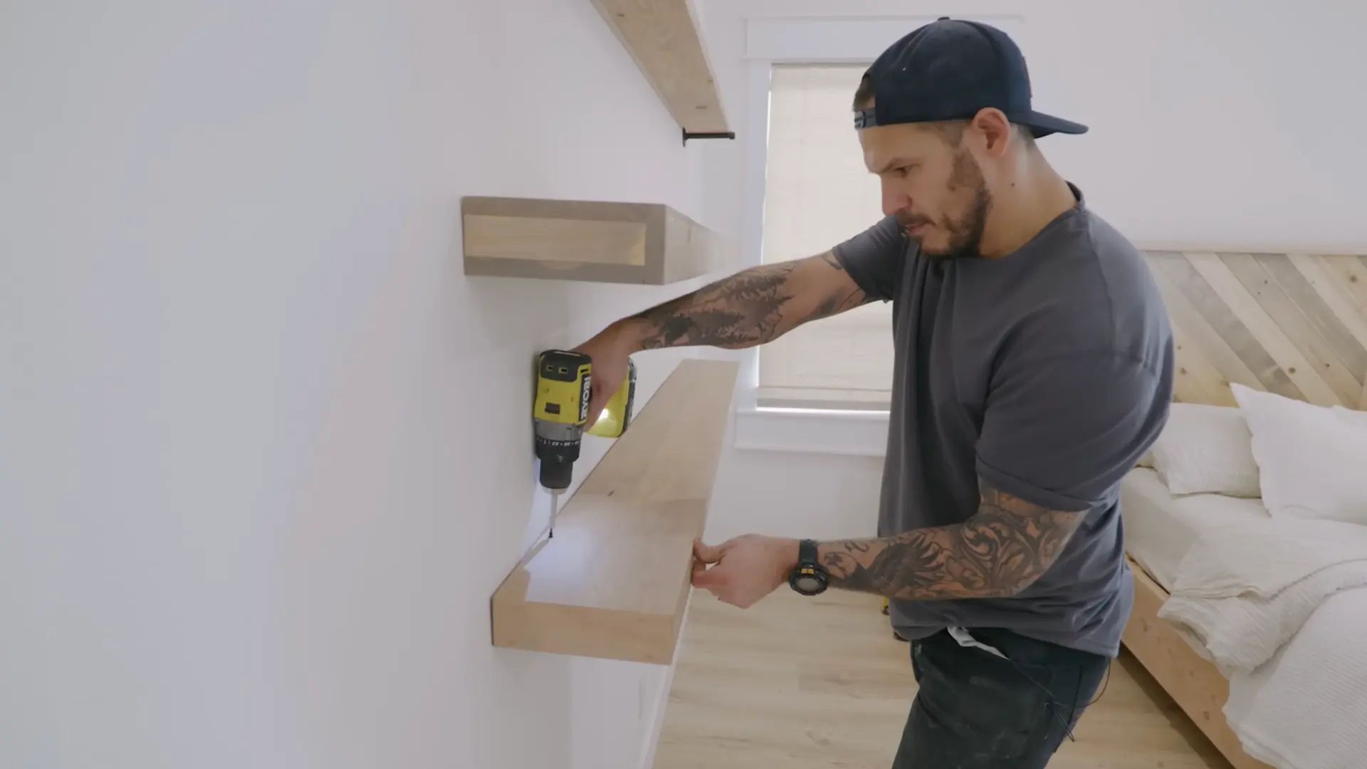 mounting a finished plywood shelf box onto a wall frame