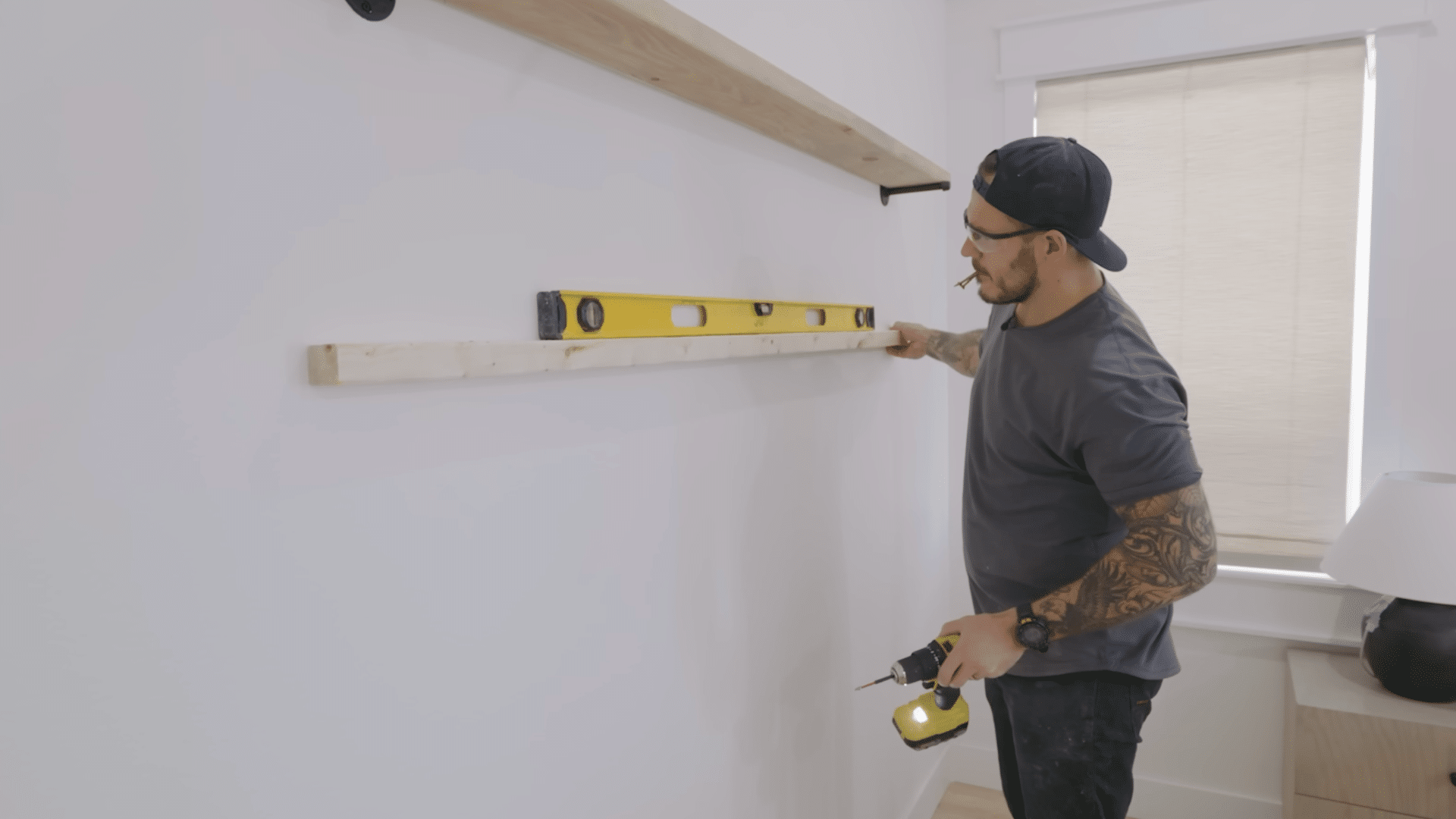 mounting flange caps and rods into wall studs for a shelf