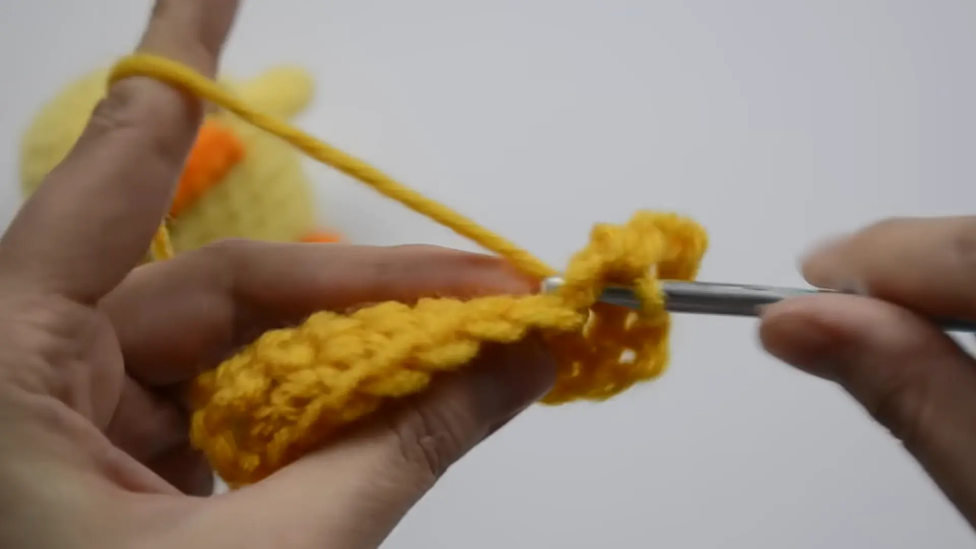 beginner turning a crochet swatch to begin the next row with working yarn attached