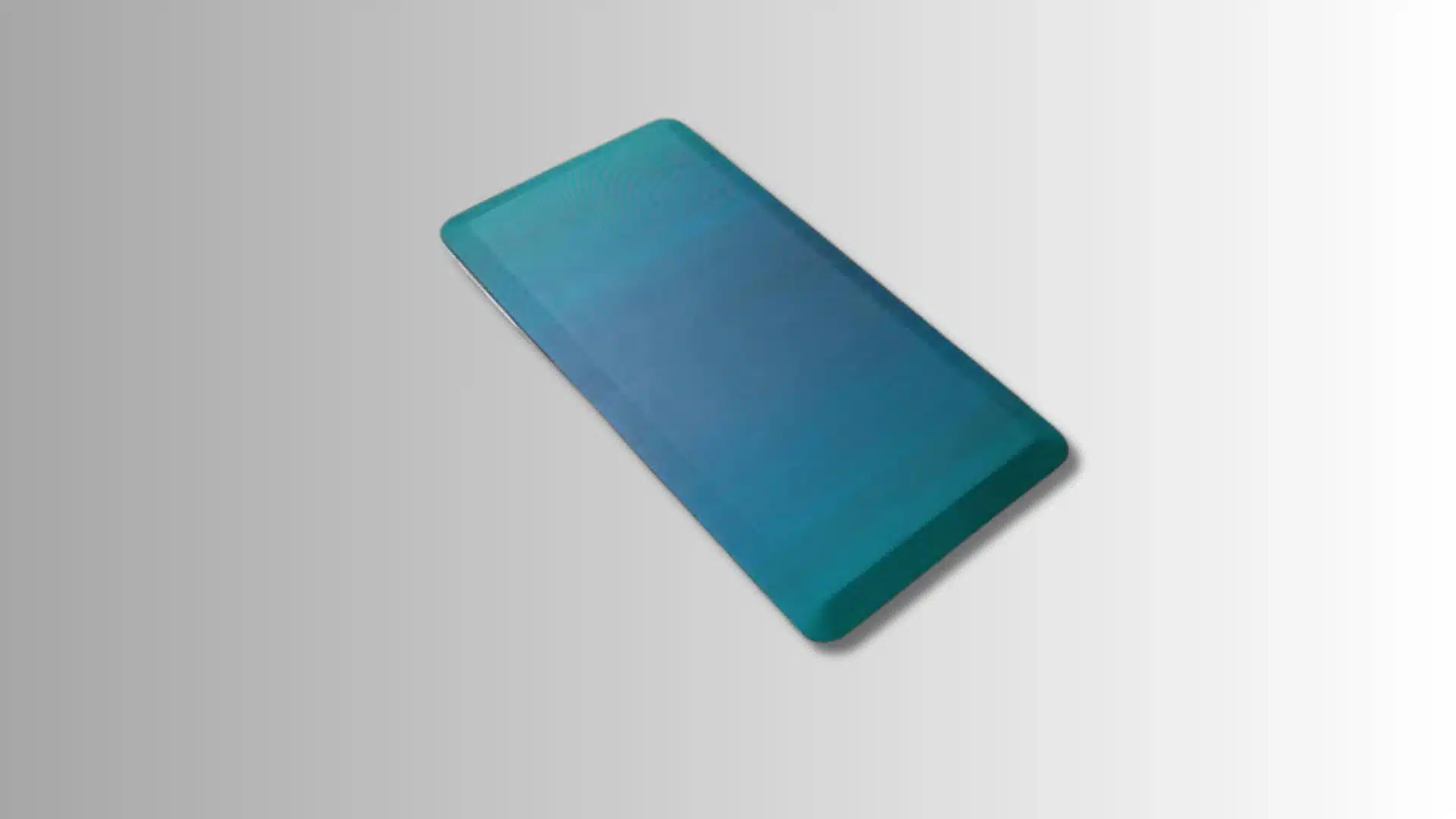 blue rectangular anti-fatigue mat with beveled edges on a gradient background
