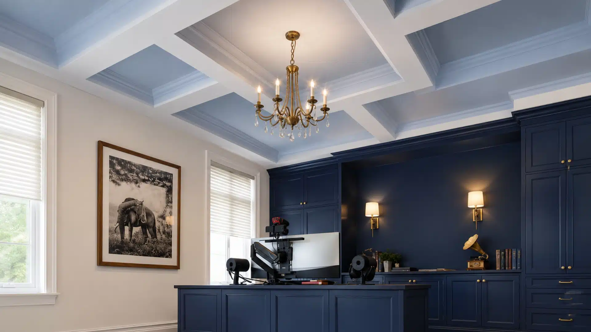 chandelier centered within a coffered ceiling grid in a dining room