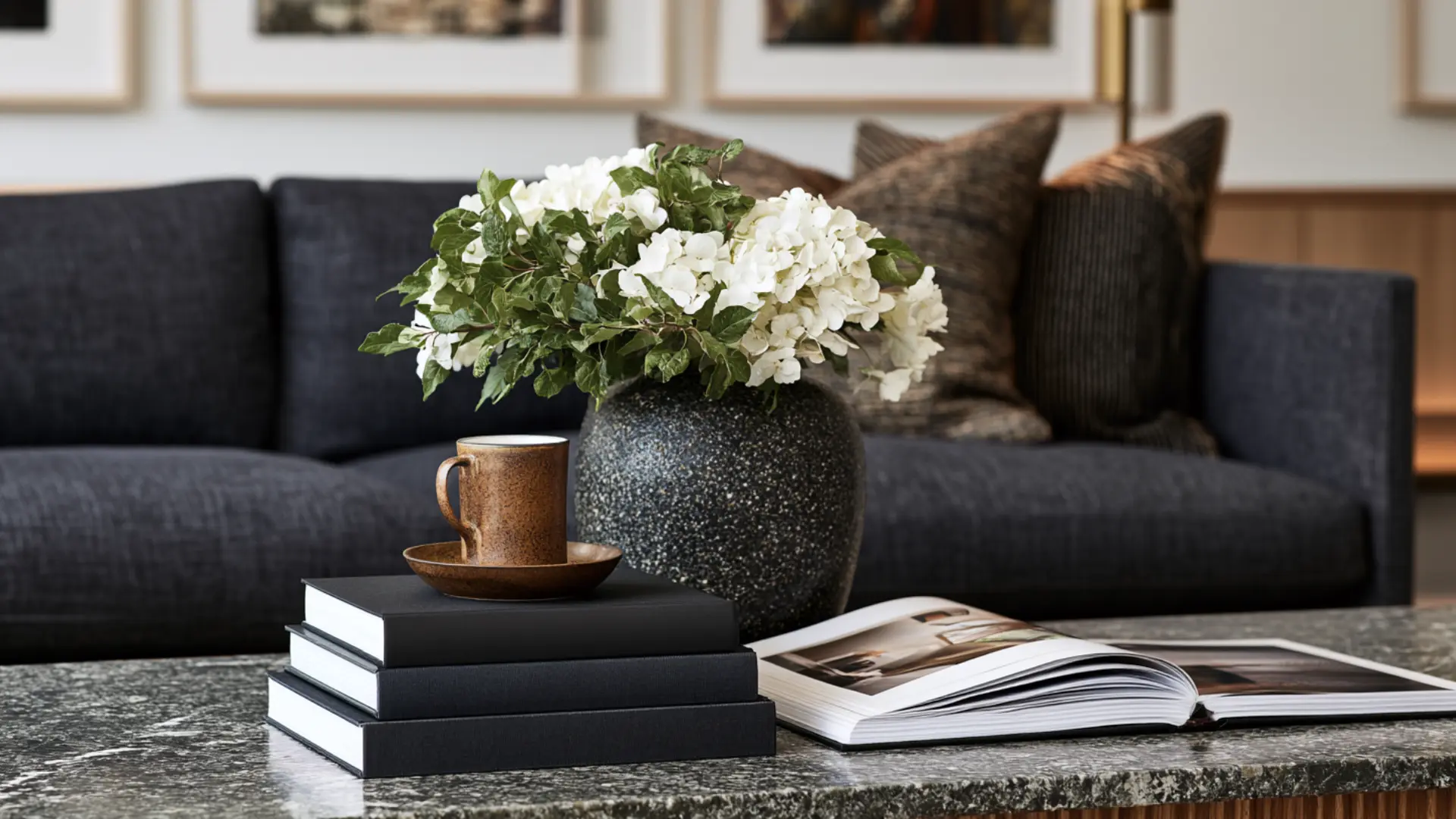coffee table decorated with a stack of art and photography books
