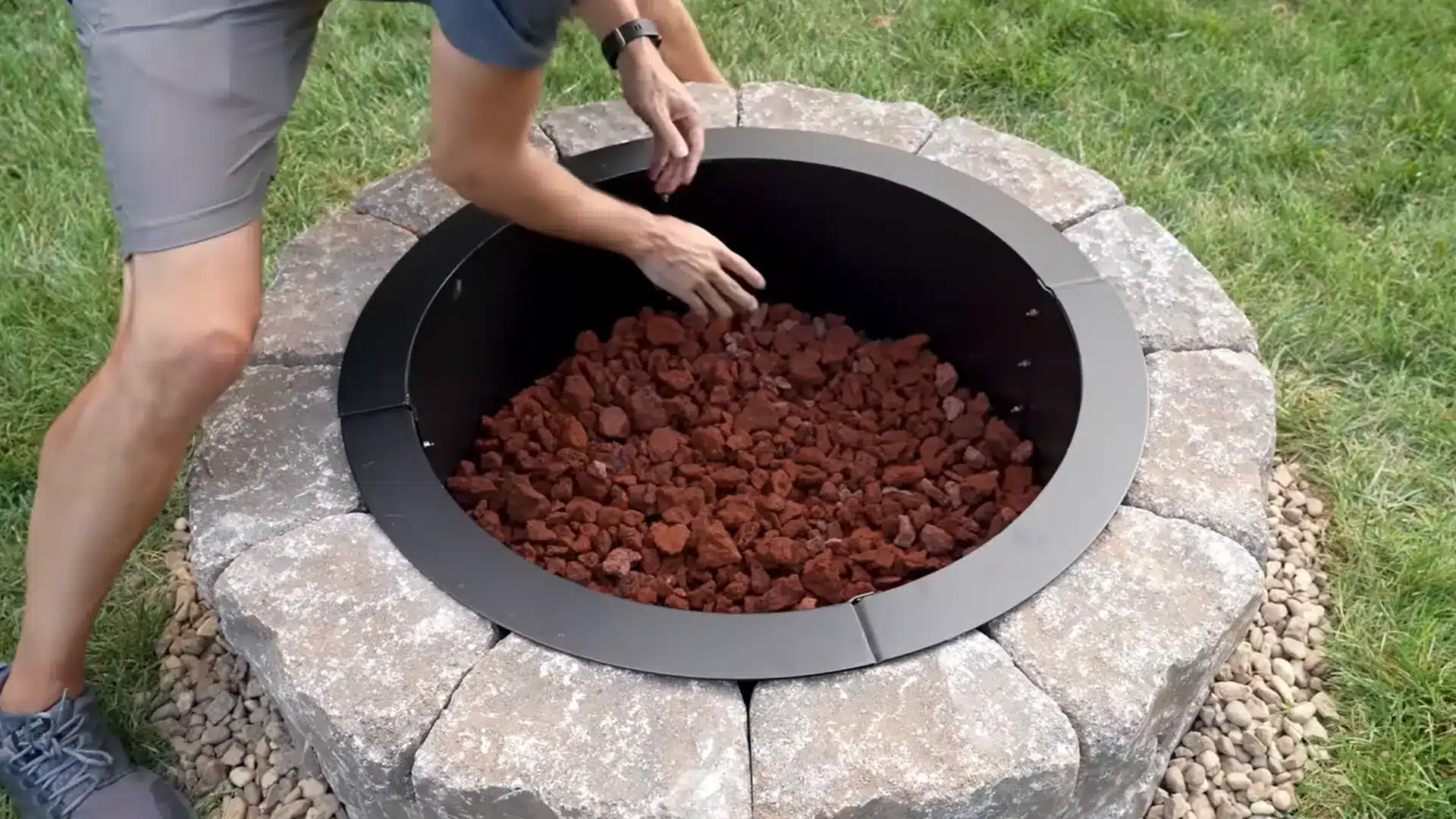 Filling a finished fire pit with lava rock and fire-safe gravel