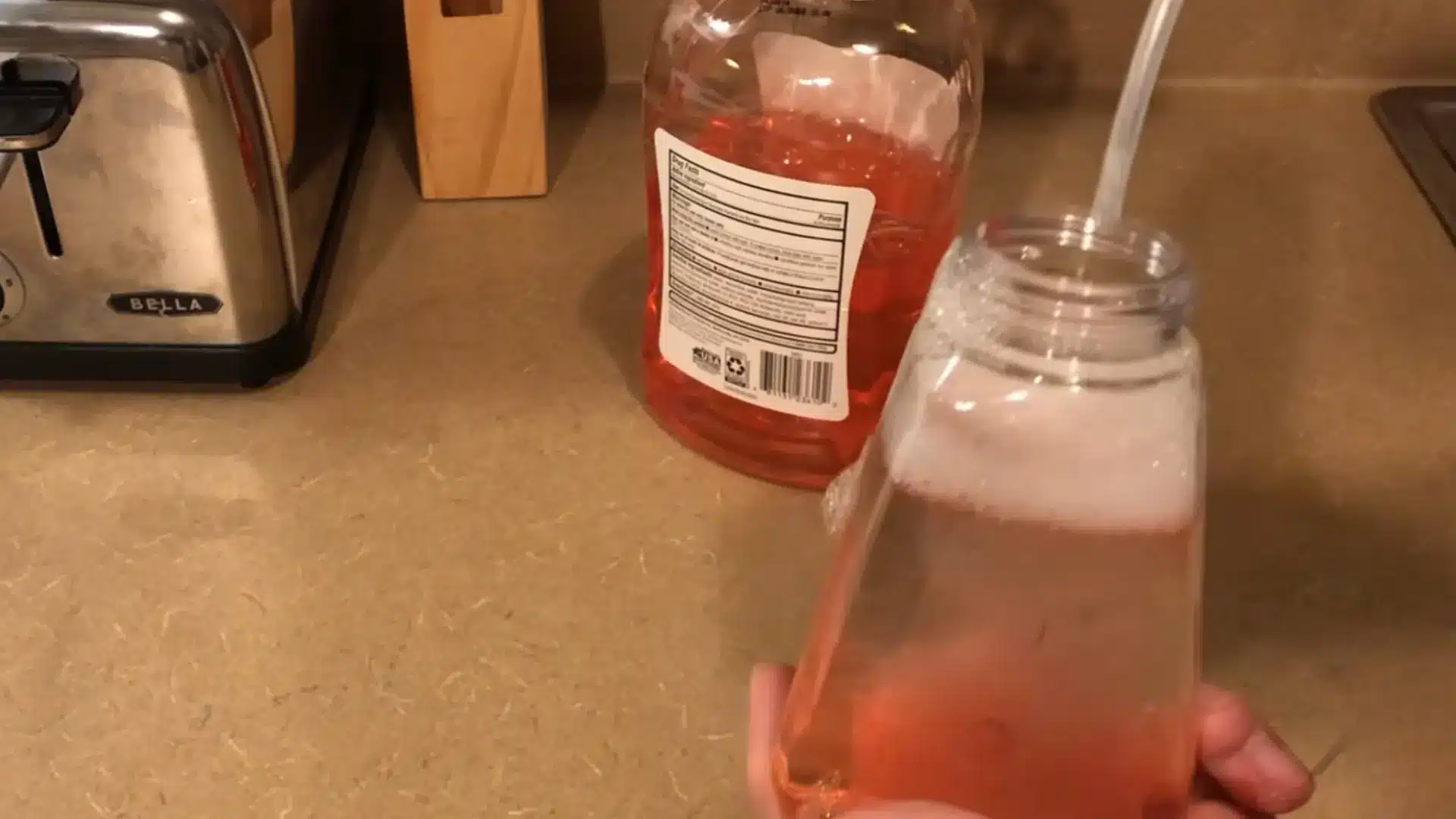 foaming dispenser filled with diluted soap and water, ready to shake and mix