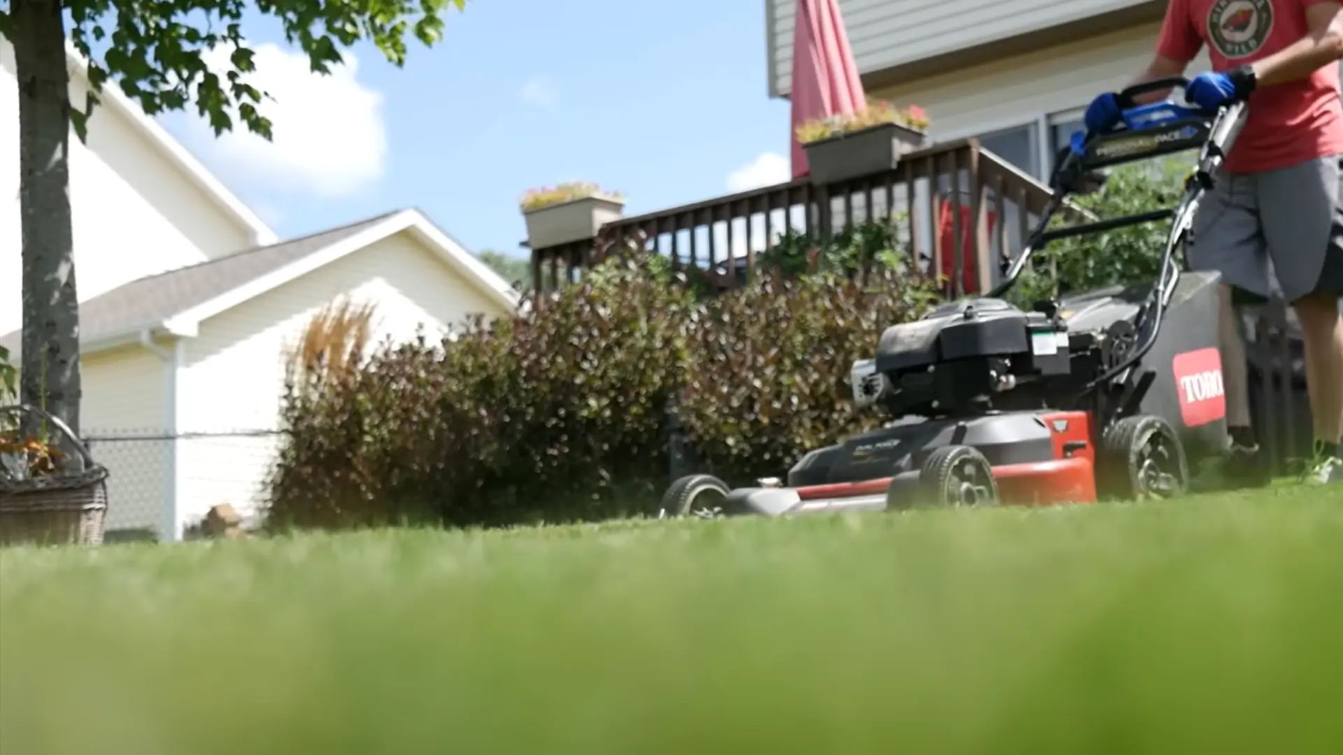 lawn being mowed short before overseeding to improve seed to soil contact and even coverage