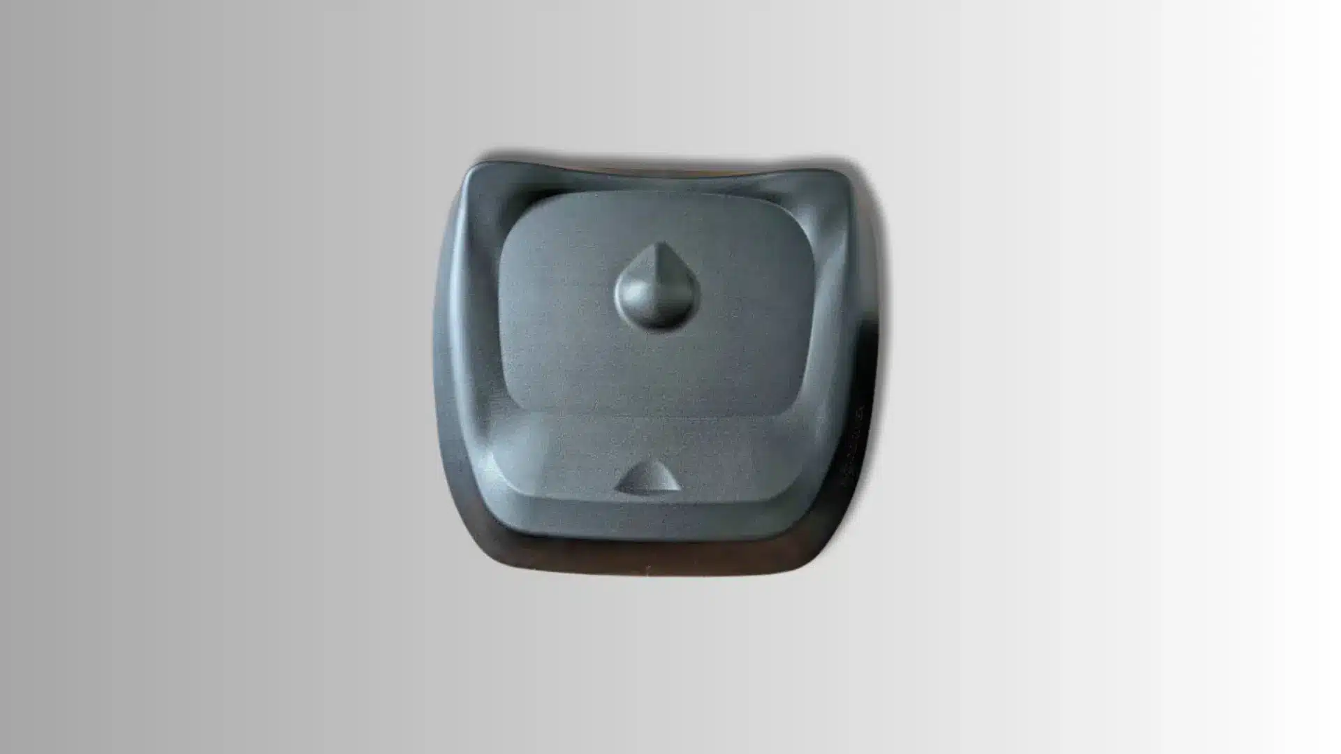 top-down view of black, contoured office standing desk mat with center dome