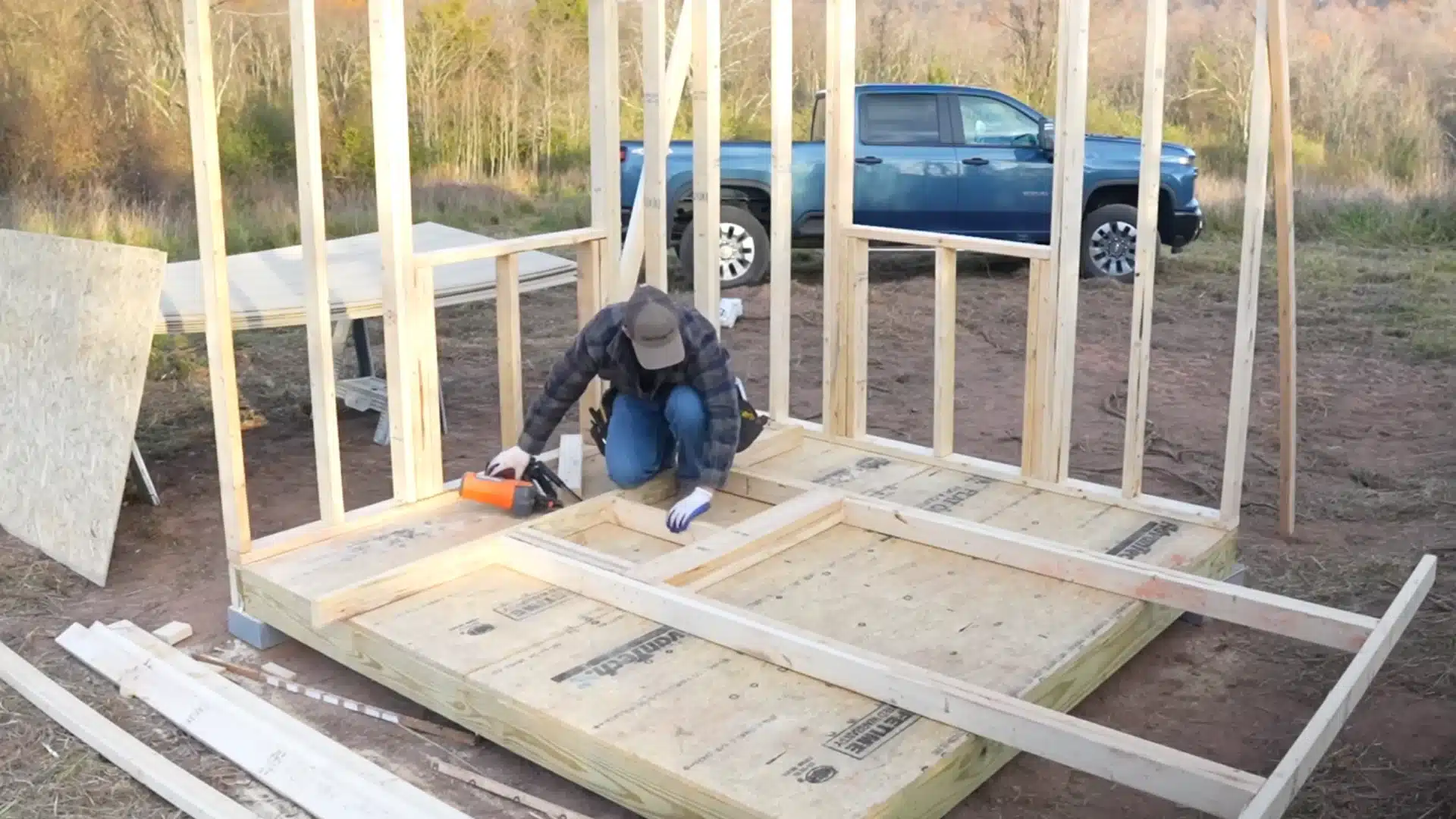 wall construction framing partially completed with vertical studs and doorway visible