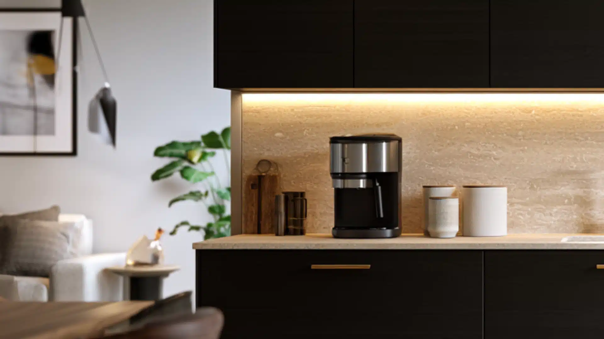 matte-black cabinets paired with pale stone backsplash and warm lighting in a coffee bar
